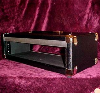 1995 Ford Bronco - A black rackmount case with metal hardware is shown against a velvet background.