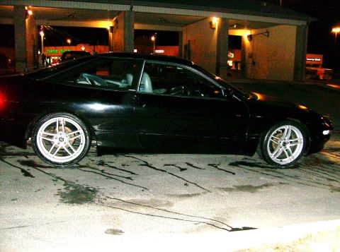 1995 Ford Probe - Side view of a black 1995 Ford Probe coupe.