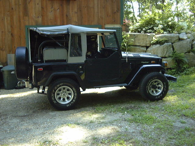 1974 Toyota Land Cruiser FJ40 with soft top, parked outdoors