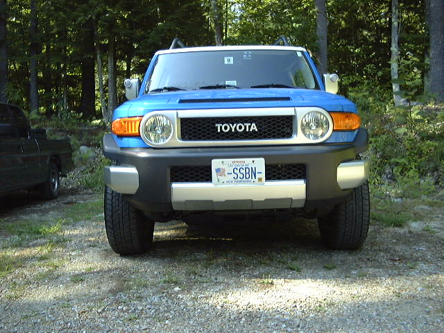 Blue 2007 Toyota FJ Cruiser parked in a wooded area