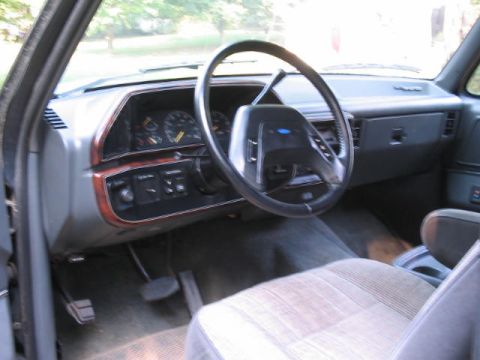 1989 Ford Bronco - Interior view of a 1989 Ford Bronco, the dashboard and steering wheel.
