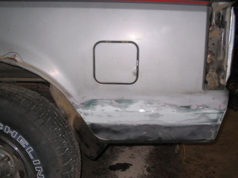 1989 Ford Bronco - This vehicle's rear quarter panel shows signs of repair and rust, with a square fuel door visible.