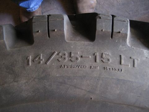 1995 Ford Bronco - The tire sidewall displays its size and approved rim specifications.
