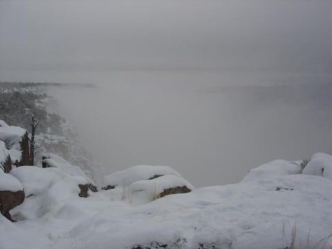 1956 Ford Bronco II - A snowy landscape in a canyon, with fog obscuring the view.