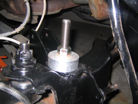 1993 Ford Bronco - A suspension component, likely a lift spacer, is shown installed on the vehicle's frame.