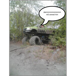 1995 Dodge 1500 - Modified pickup truck with oversized tires sits in a wooded area, with a speech bubble above it.