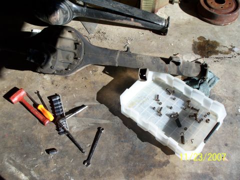 2007 Ford Ranger - A disassembled rear axle assembly and a collection of tools are laid out on a concrete surface, with a date stamp indicating 11/23/2007.