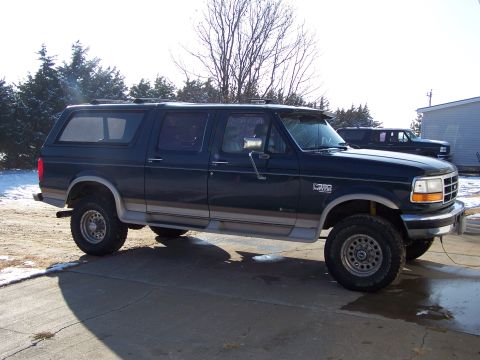 1995 Ford C-350 (Centurion Conversions) - 1995 Ford C-350 Centurion Conversion SUV, seen in a driveway with a second vehicle behind it.