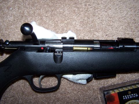 1995 Ford C-350 (Centurion Conversions) - Rifle action detail with a loaded round and a box of Federal Premium ammunition visible.