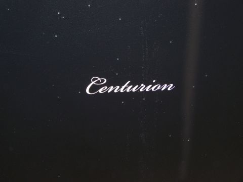 1995 Ford C-350 (Centurion Conversions) - The word 'Centurion' is visible in white script on a dark surface.