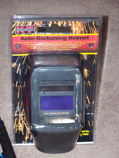 1995 Ford C-350 (Centurion Conversions) - A new auto-darkening welding helmet is shown in its retail packaging, ready for use.