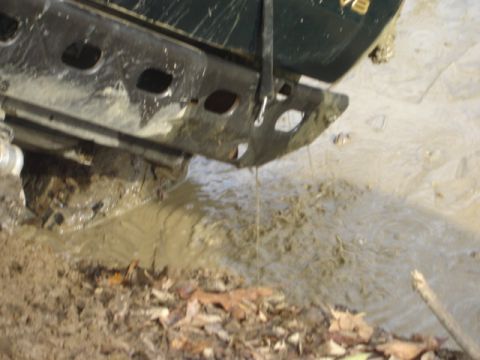 1992 Ford Bronco - This vehicle's rear bumper is submerged in thick mud.