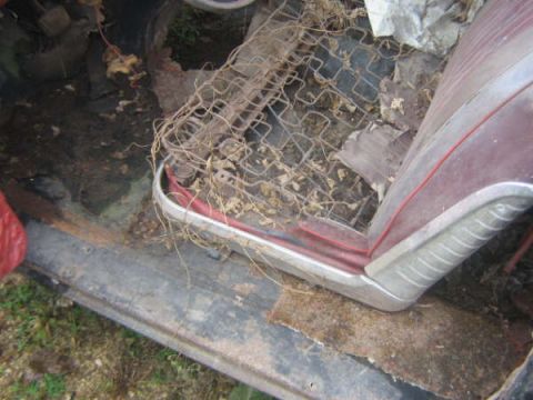 1963 Ford Galaxie - The interior of this vehicle is in disrepair, with exposed seat springs and debris scattered around.