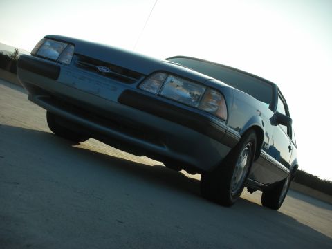 1990 Ford Mustang - Front 3/4 view of a blue 1990 Ford Mustang convertible.