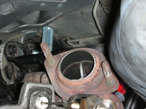 1990 Ford Mustang - Close-up view of an exhaust manifold flange, showing the connection point for the exhaust system.