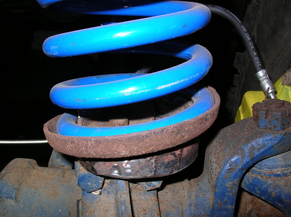 I had to cut the perches 3/4 around, taking note as to where the coil first touches them as the lowest point, and shaping it in a sort of coil and welding sides to it.