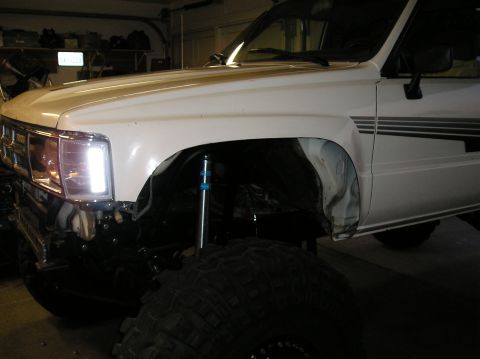 1986 Toyota Hilux - Front fender and suspension detail of a 1986 Toyota Hilux, modified for off-road use.