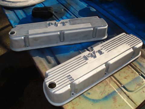 1984 Ford Bronco - Pair of Edelbrock valve covers on a blue surface.