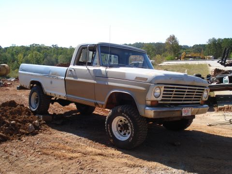 1967 Ford F-250 - This 1967 Ford F-250 pickup truck features a lifted suspension and off-road tires.