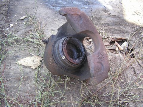 1989 Ford Bronco - Caliper off Bronco that was bleeding, Check out the Phenolic Piston.