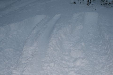 2003 Jeep TJ - Tire tracks are visible in the snow, indicating recent vehicle passage.