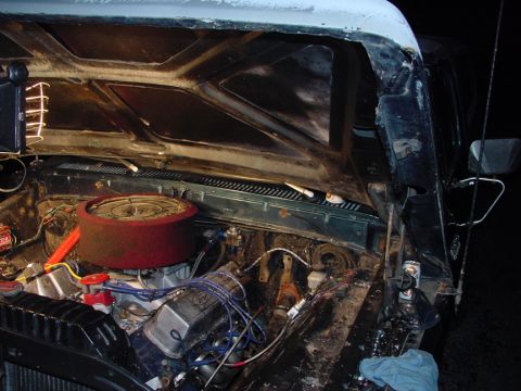 1979 Ford Bronco - The engine bay of a vehicle is shown with various mechanical components visible.