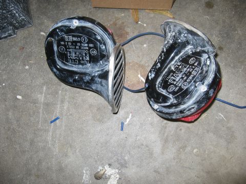 2000 Ford Ranger - A pair of FIAMM car horns, likely removed from a vehicle, are shown on a concrete surface.