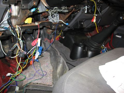2000 Ford Ranger - A complex and disorganized wiring harness is visible inside the vehicle's cabin.