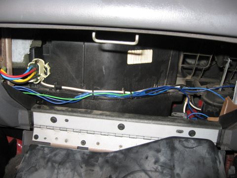 2000 Ford Ranger - Close-up of a vehicle's interior wiring harness, showing multiple colored wires and connections.