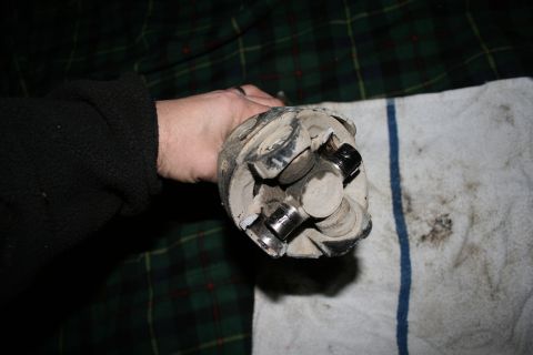 2003 Jeep TJ - Close-up of a universal joint, likely needing replacement due to wear.