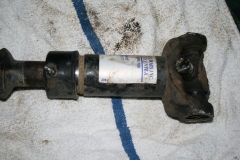 2003 Jeep TJ - A driveshaft component rests on a white towel with blue stripes.
