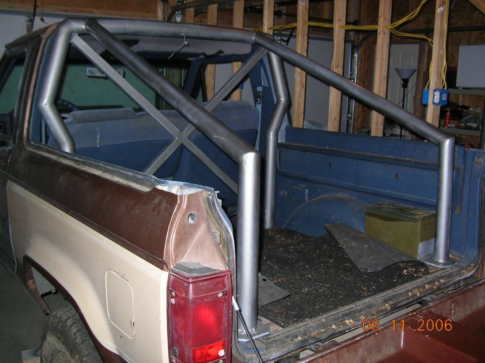 I made the lift gate a fold down tail gate. The roll bar is designed to have a soft top stretched across it.