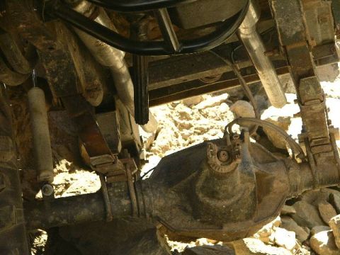 1987 Suzuki Samurai - Close-up view of the undercarriage, showing the rear differential and suspension components.