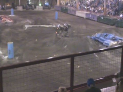 1984 Ford Bronco - A demolition derby event is underway with several damaged vehicles on the dirt track.