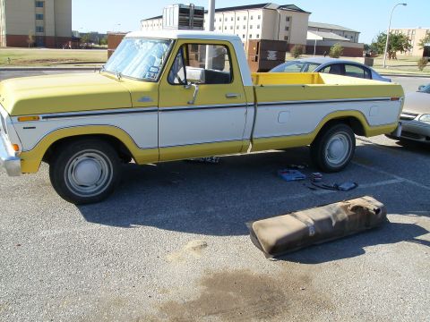 1979 Ford F-100 - Side view of a 1979 Ford F-100 pickup truck with its fuel tank removed for service.