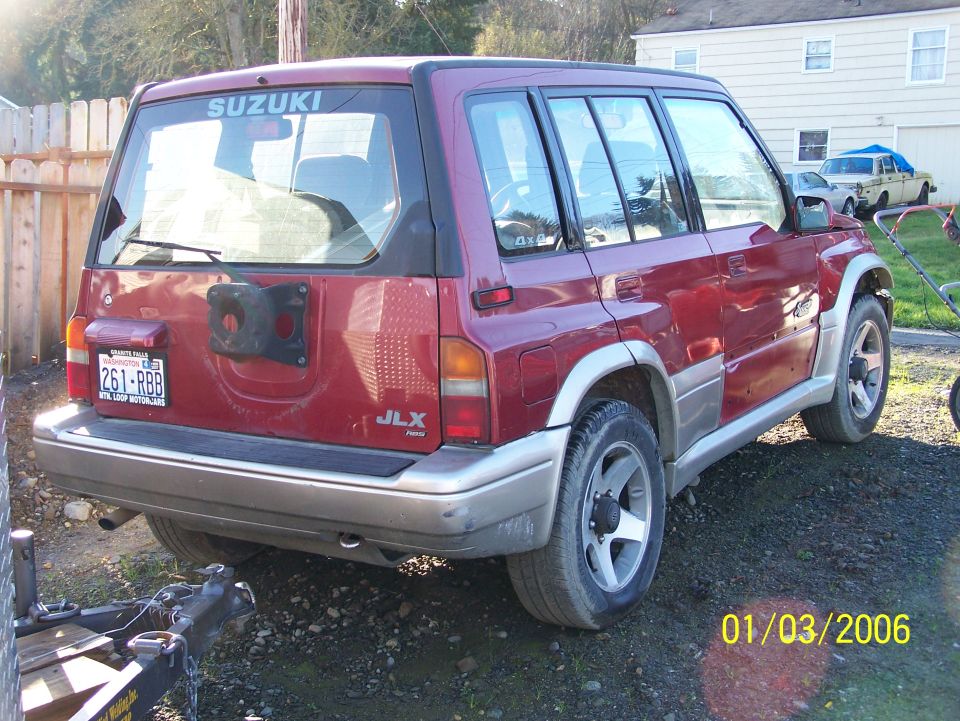 1988 Suzuki Samurai JLX, rear view. Spare tire mount on rear door, license plate 261-RBB