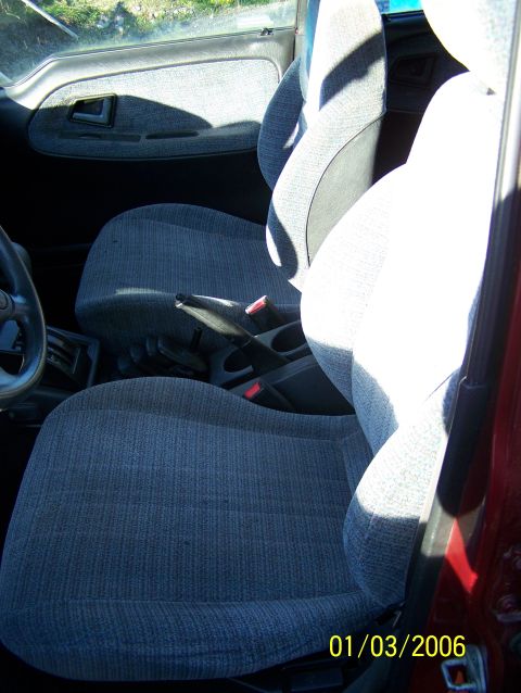 1988 Suzuki Samurai - Interior view of a vehicle's front seats and door panel, with a date stamp visible.
