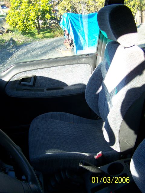 1988 Suzuki Samurai - The interior of a vehicle is visible, with a focus on the seats and door panel, dated January 3, 2006.