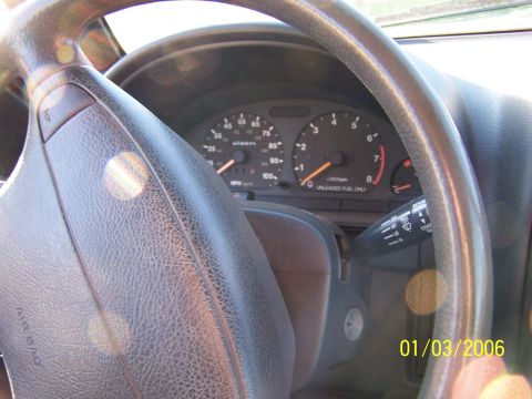 1988 Suzuki Samurai - Interior view of a 1988 Suzuki Samurai, focusing on the dashboard and steering wheel.