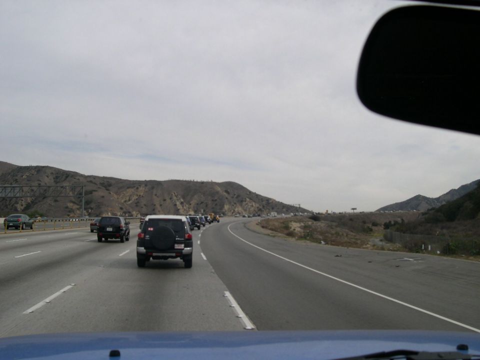 White Toyota FJ Cruiser from rear on highway, 2007