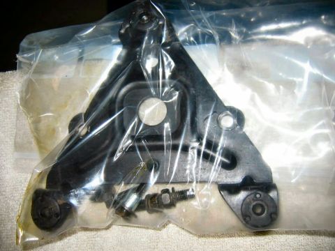 1985 Ford LTD Crown Victoria - Unidentified automotive part in plastic packaging with hardware.