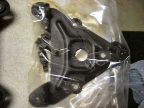 1985 Ford LTD Crown Victoria - A car part, possibly a bracket, is shown in clear plastic packaging.