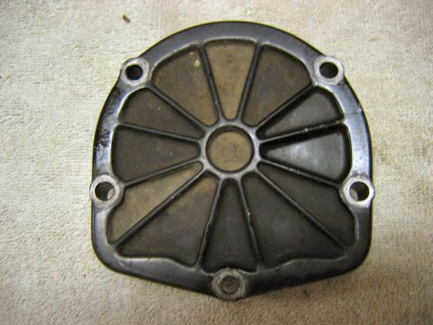 1985 Ford LTD Crown Victoria - This is a metal part with a distinctive radial spoke design and four mounting holes, likely an automotive component.