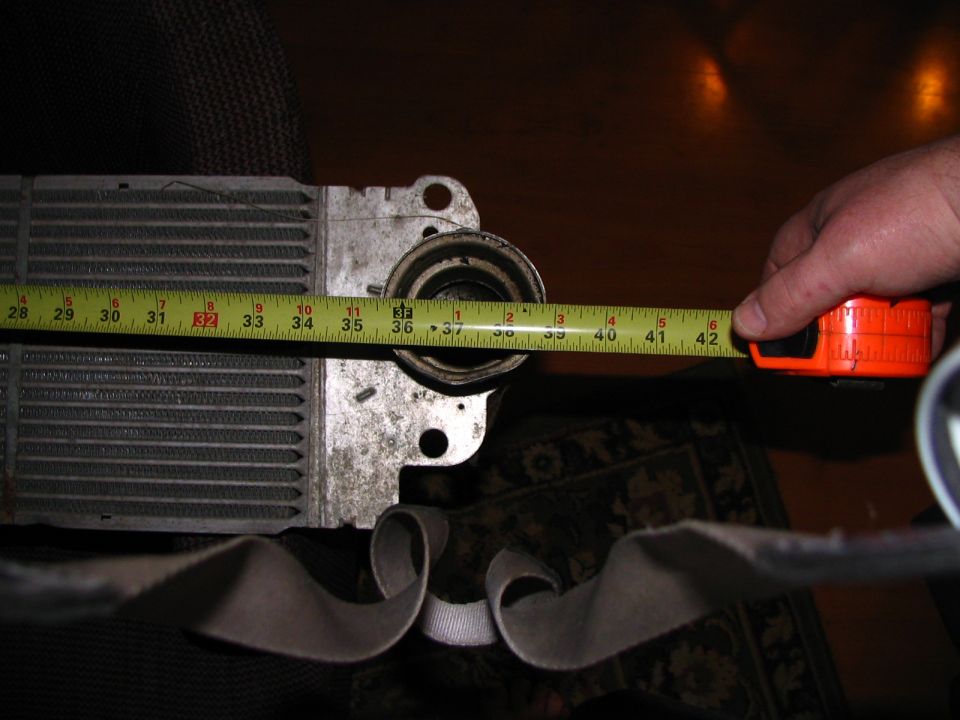 Radiator being measured with a tape measure
