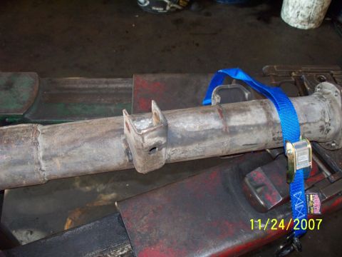 2007 Ford Ranger - A close-up view of a metal axle component, possibly from a vehicle, with a blue strap holding it in place.