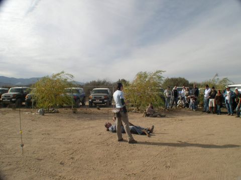 2007 Toyota FJ Cruiser - A group of people stand around several Toyota FJ Cruisers parked in an outdoor lot.
