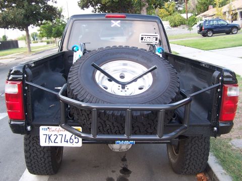 2007 Ford Ranger - Rear view of a 2007 Ford Ranger pickup truck, showing the spare tire mounted in the bed.