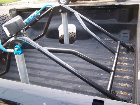2007 Ford Ranger - A truck bed is fitted with a custom roll cage and high-performance shocks.