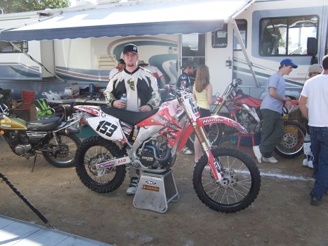 2007 Ford Ranger - A motocross event scene with multiple dirt bikes and an RV.