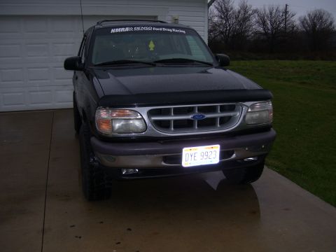 1996 Ford Explorer - This black Ford Explorer SUV is shown from the front, a license plate that reads OYE 9923.